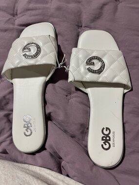 GBG Los Angeles White Quilted Slide Sandals with Silver Logo Accent